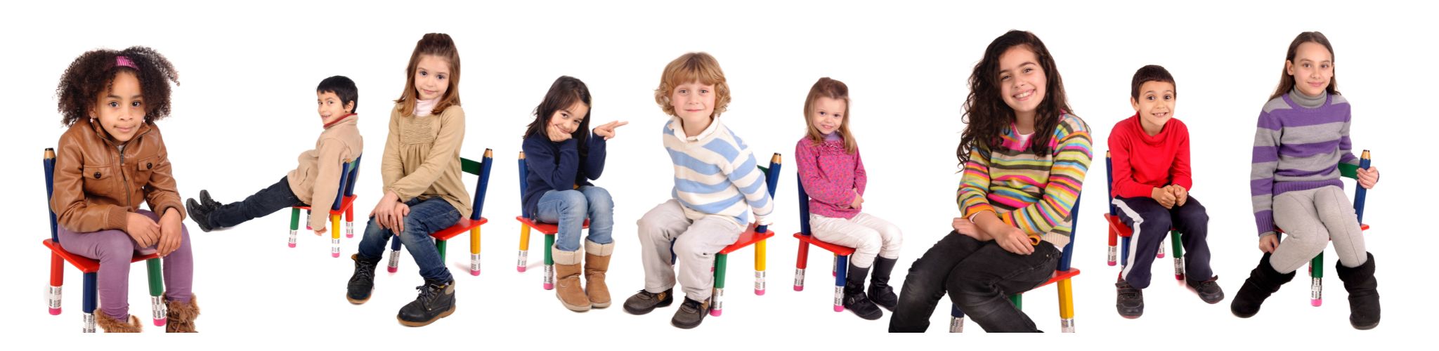 Photo of children holding chalkboards that spell out the word school